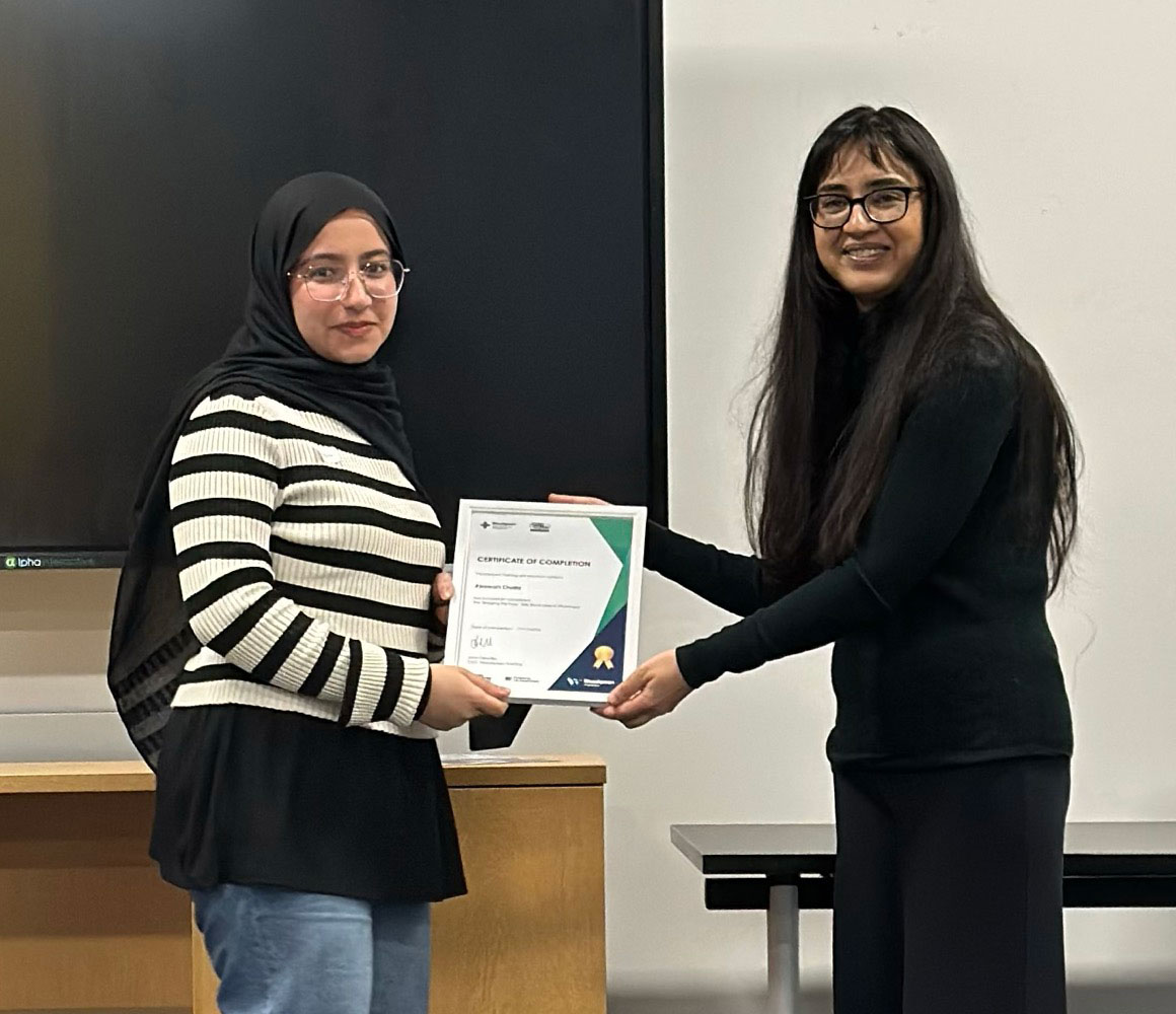 Abeerah Khalid receiving her certificate