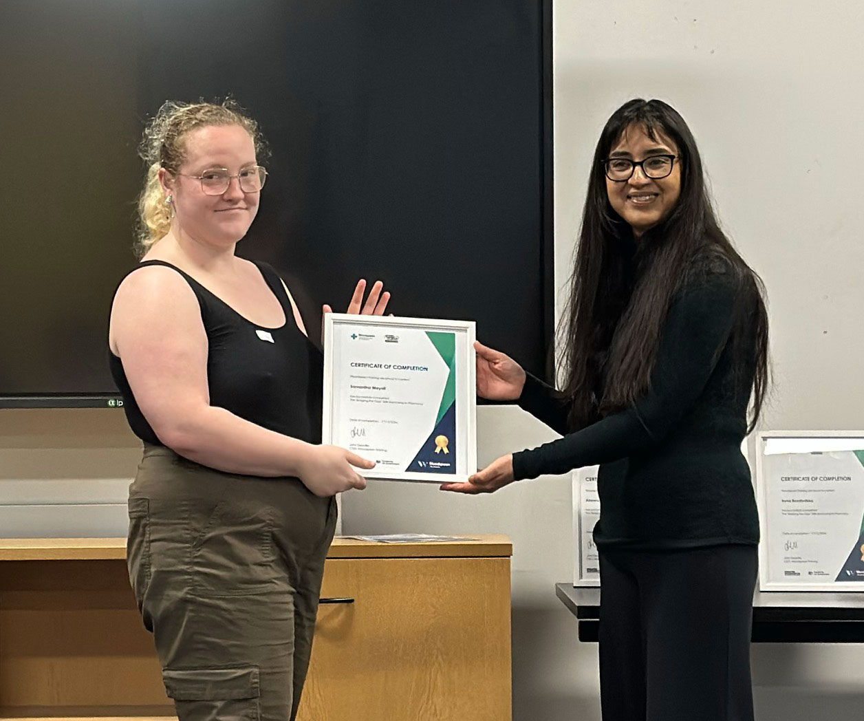 Sam Mayall receiving her certificate